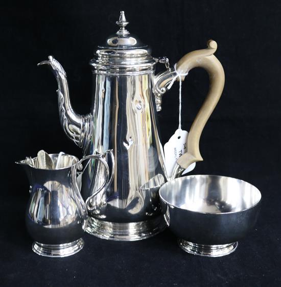 A matched three-piece silver coffee set, London 1961-1963, makers D. & J. Welby Ltd, total inc spoons approx 28oz